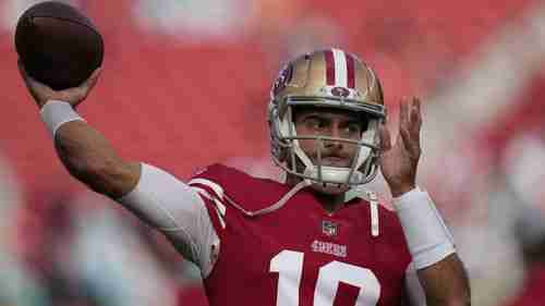 Jimmy Garoppolo warming up football